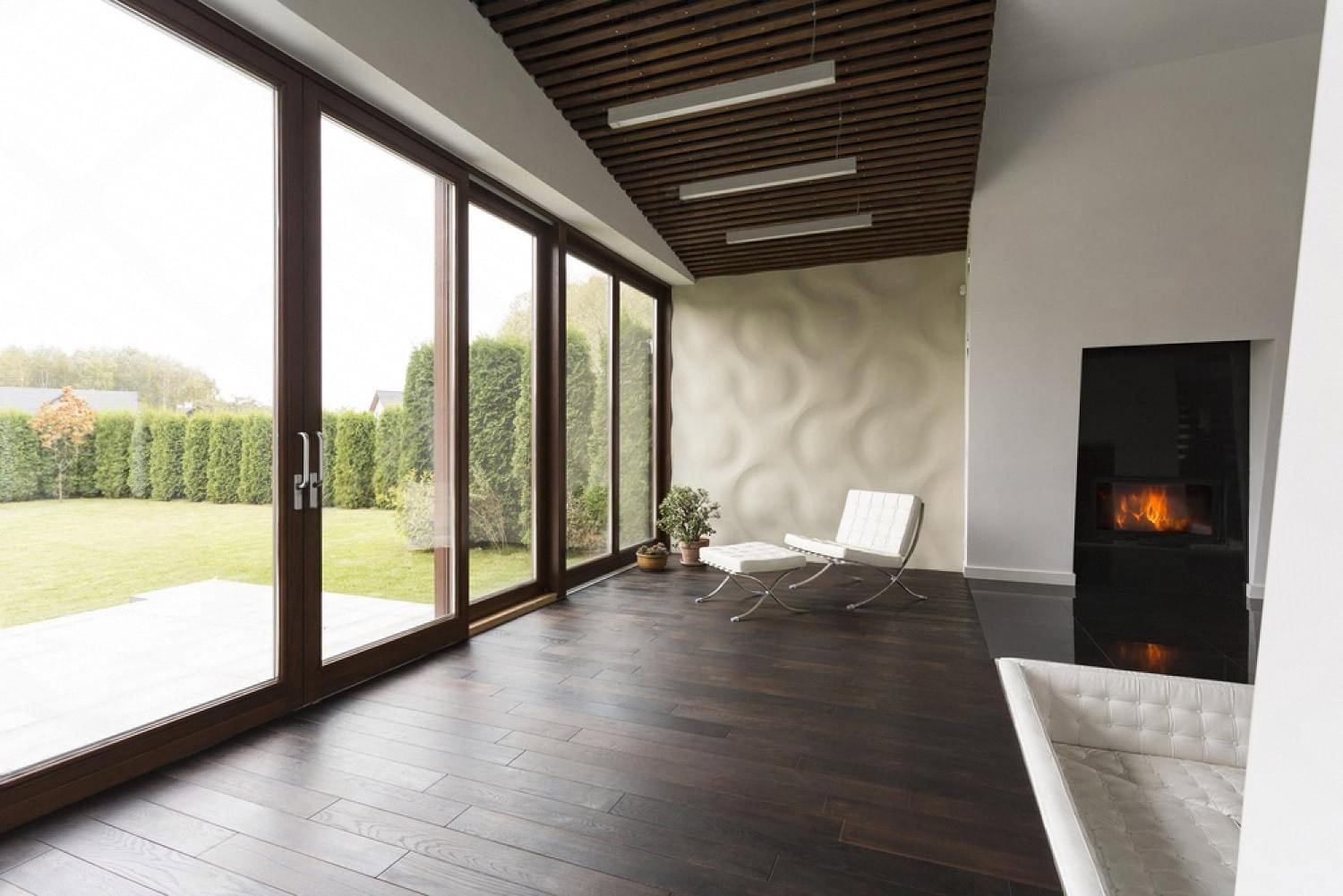 Modern UAE terrace with overhead electric heaters and a corner fireplace prepared for guests